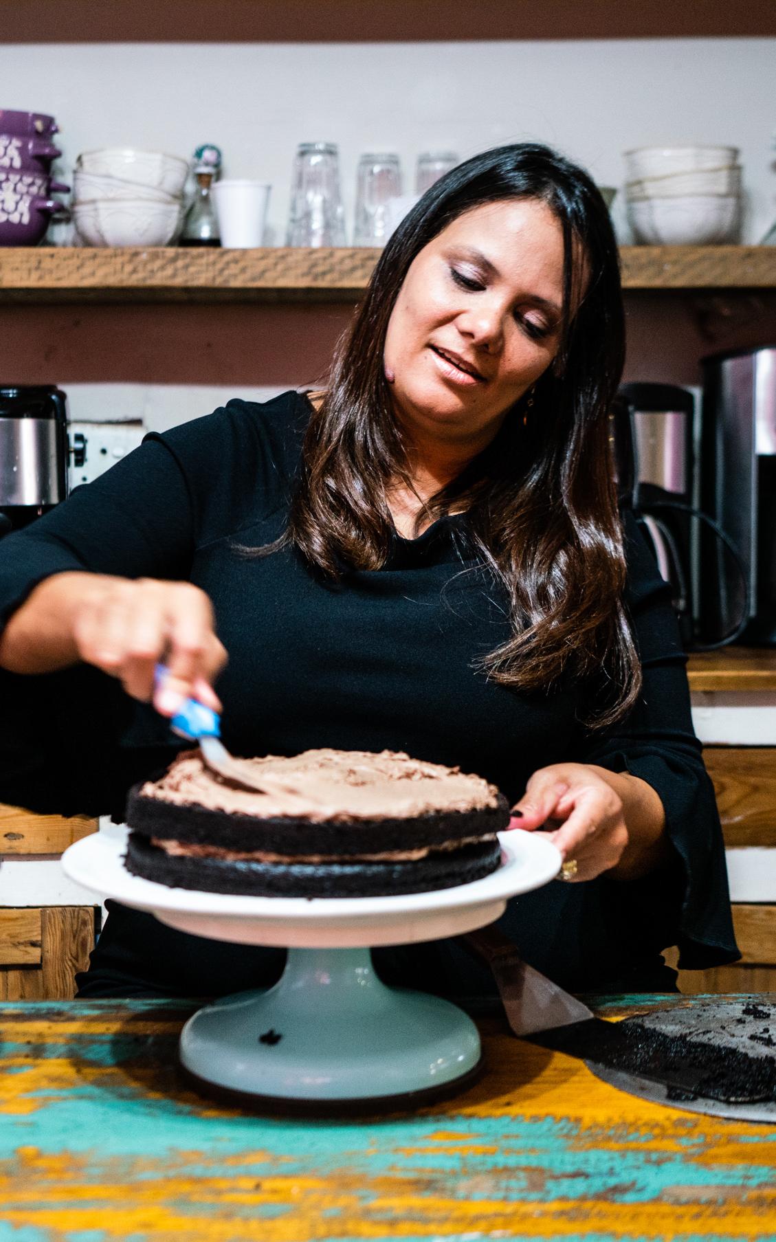 Woman icing a cake