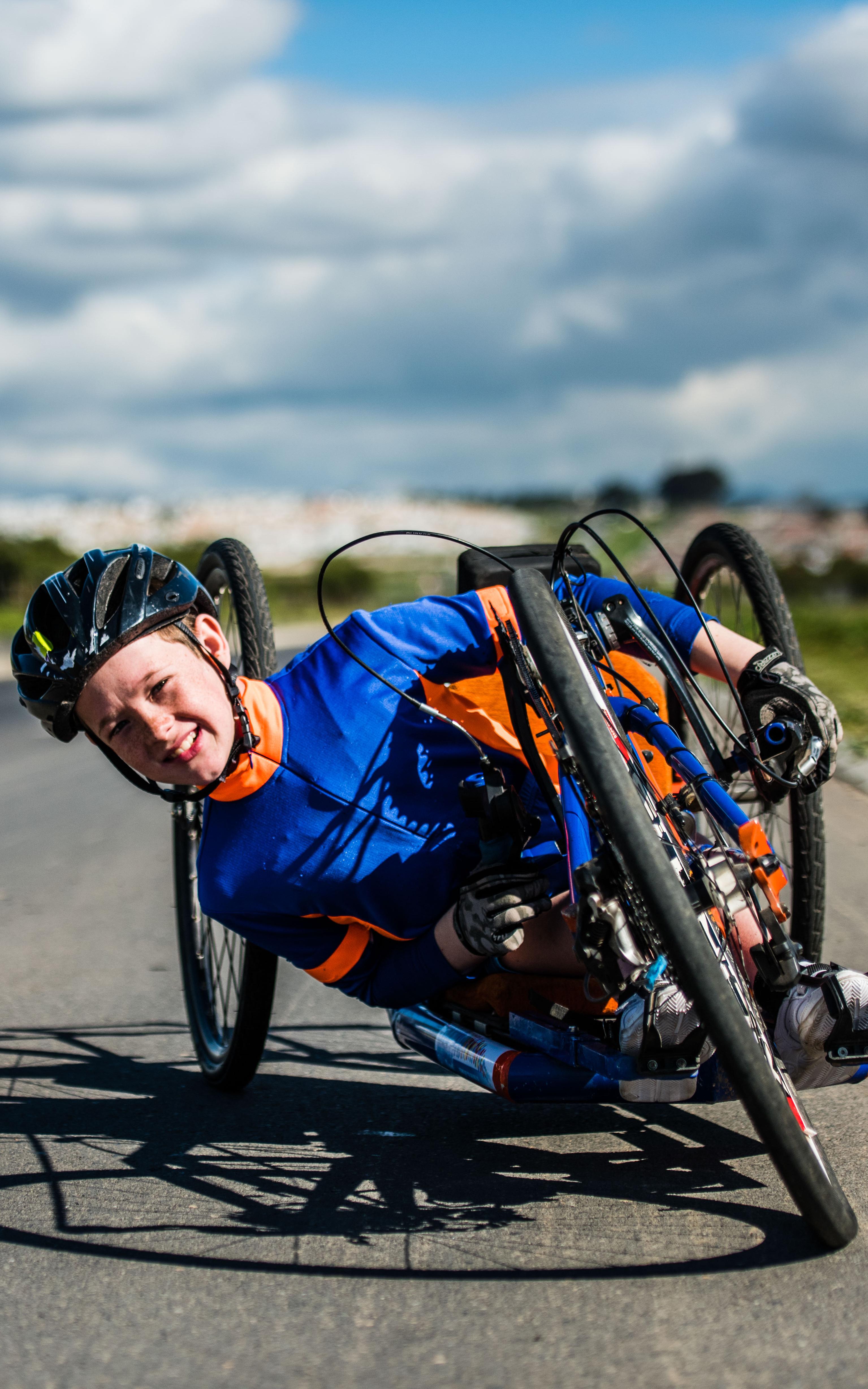 The country’s youngest handcyclist speeds past disability with his winning attitude