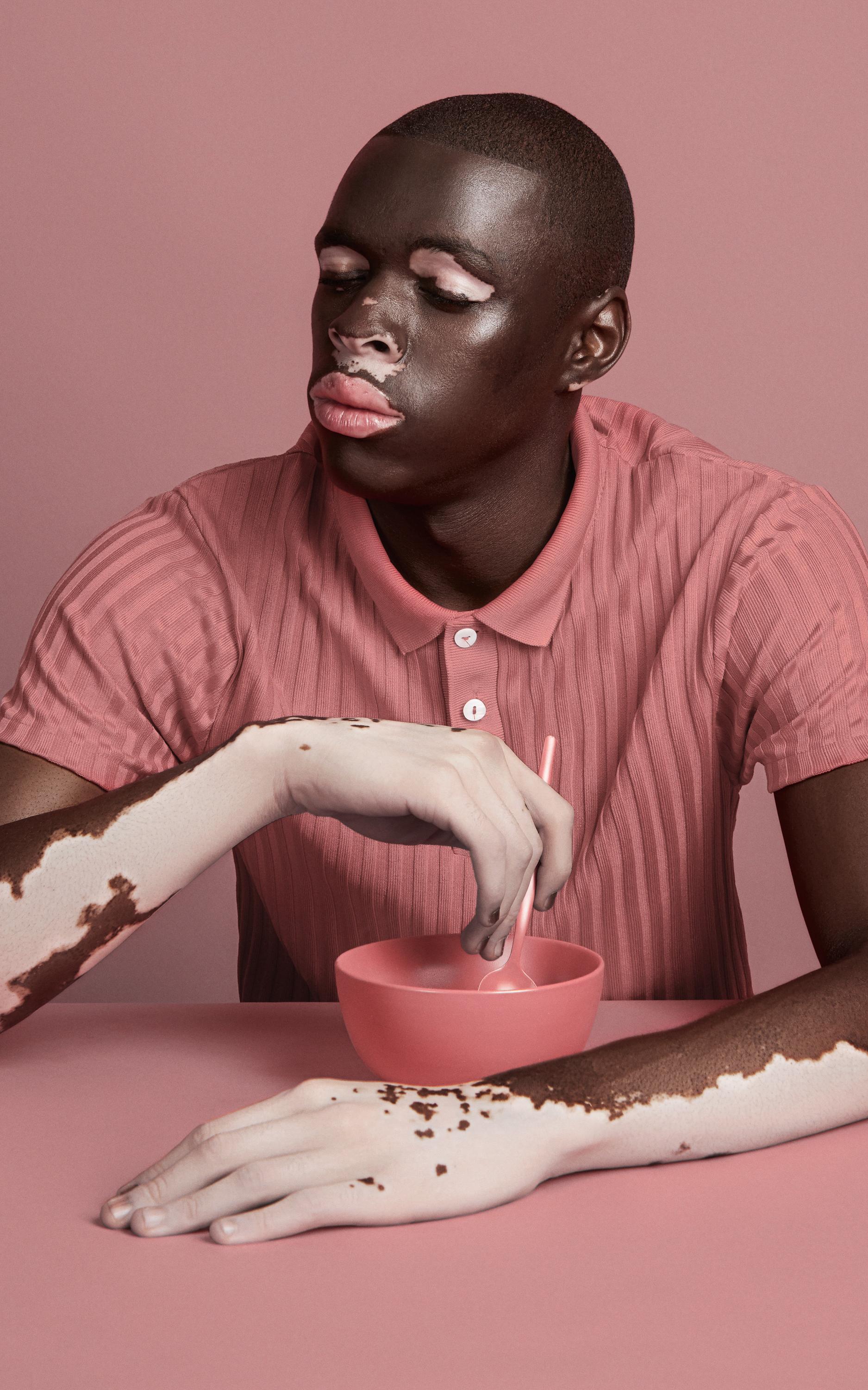 Man at a pink table