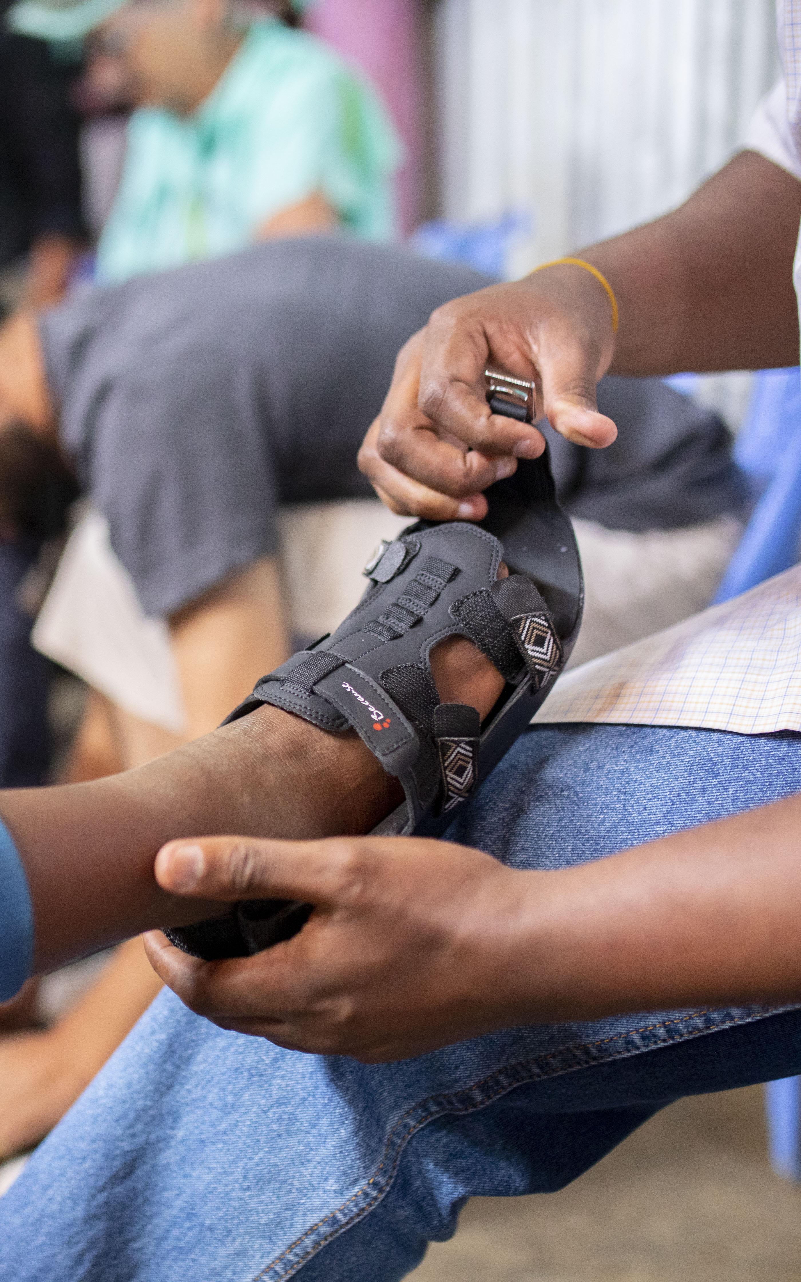man holding foot. 