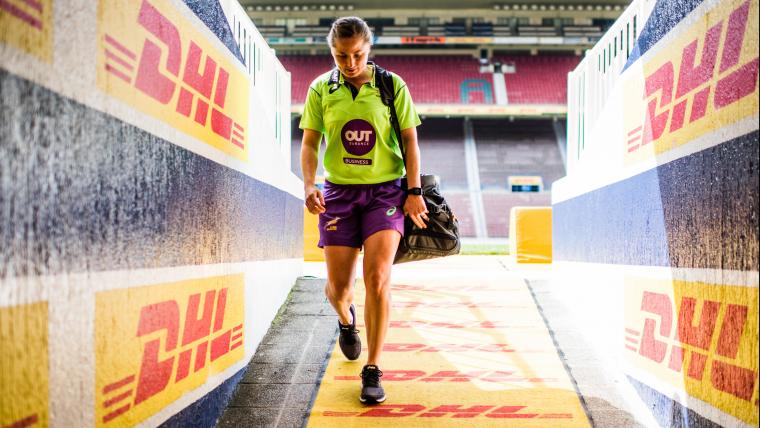 Boy exiting sport stadium