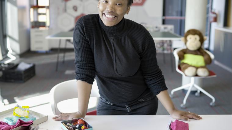 A lady teaching people how to make their own reusable sanitary pads.