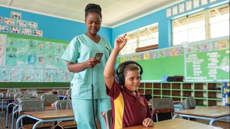 school kid wearing headphones