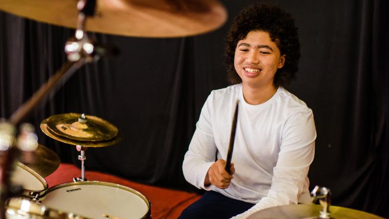Boy playing drums
