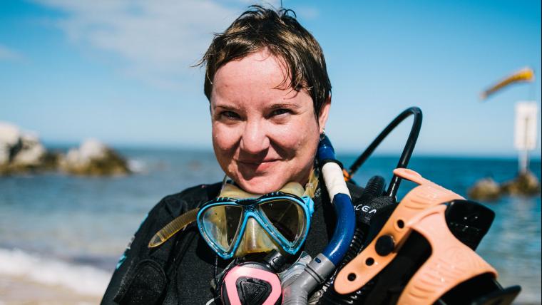 Woman in scuba gear.
