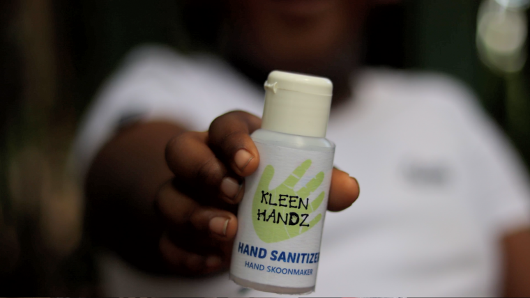 Hand with hand sanitiser.